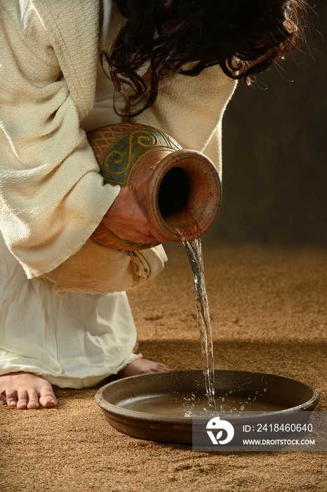 Jesus Pouring Water into Container