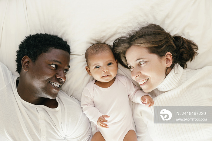 Happy Family, Mother, Father And Baby.