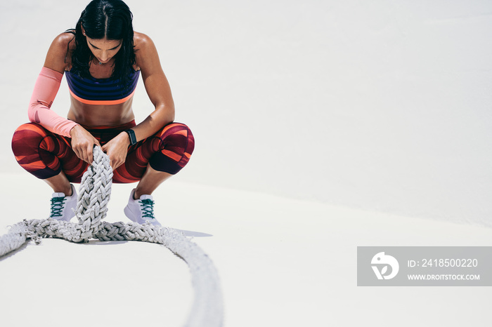 Female athlete taking rest during workout