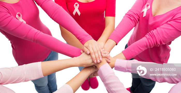 close up of women with cancer awareness ribbons