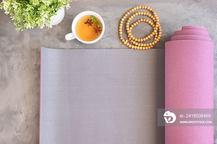 Yoga mat,mala beads and Ayurveda tea for relax yoga practice y meditation.