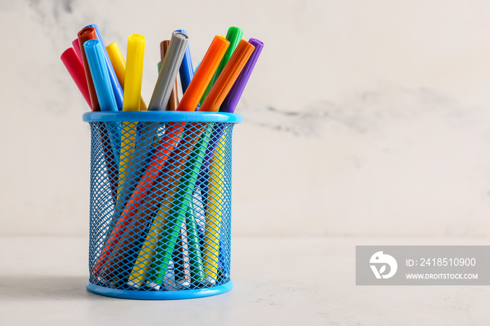 Many colorful markers on table