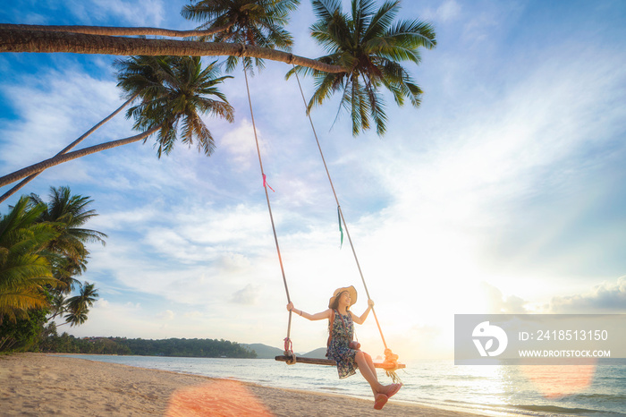 Asian girl on swing in Koh Kood island