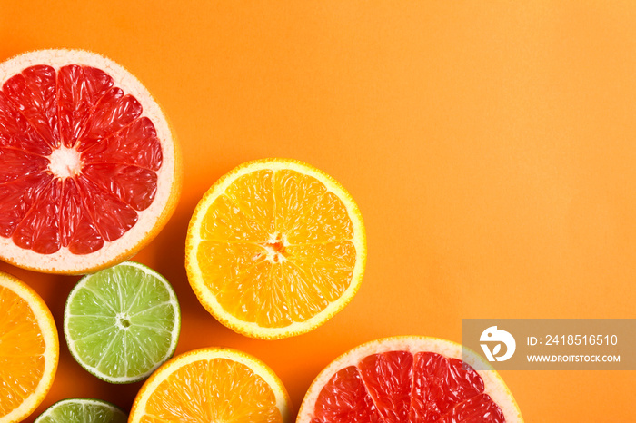 Many different citrus fruits on color background