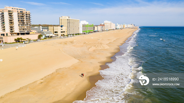 Aerial Perspective Couple Walking Along the Beach in Ocean City Maryland
