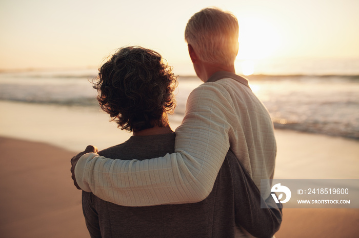 Retired couple watching amazing sunset