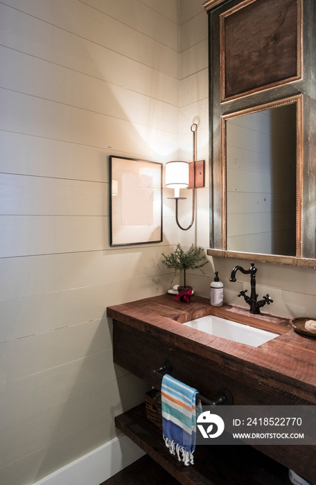 Rustic half bathroom with antique fittings.