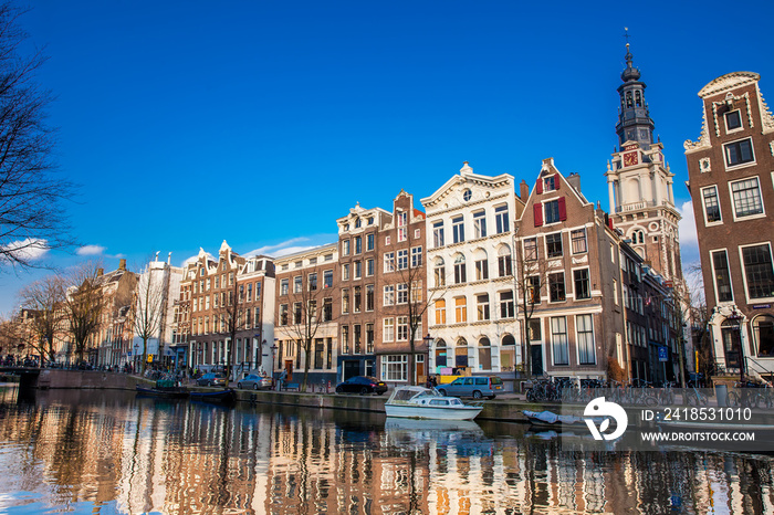 Canals, boats and beautiful architecture at the Old Central district in Amsterdam