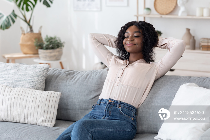 Lazy Day. Smiling Black Lady Leaning Back On Sofa With Closed Eyes