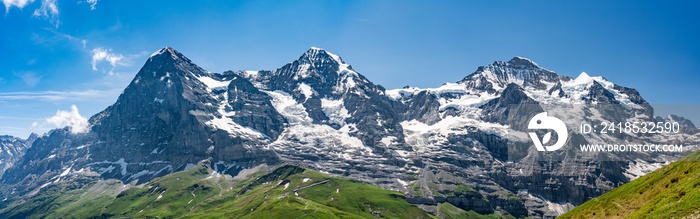 Switzerland, Panoramic view on Eiger, Monch and Jungfraujoch and green Alps around Mannlichen