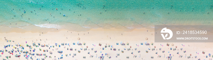 Aerial view crowded public beach with colourful umbrellas, Aerial view of sandy beach with tourists 