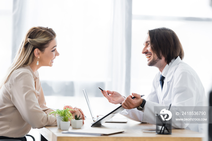 beautiful patient looking at doctor with document in hand