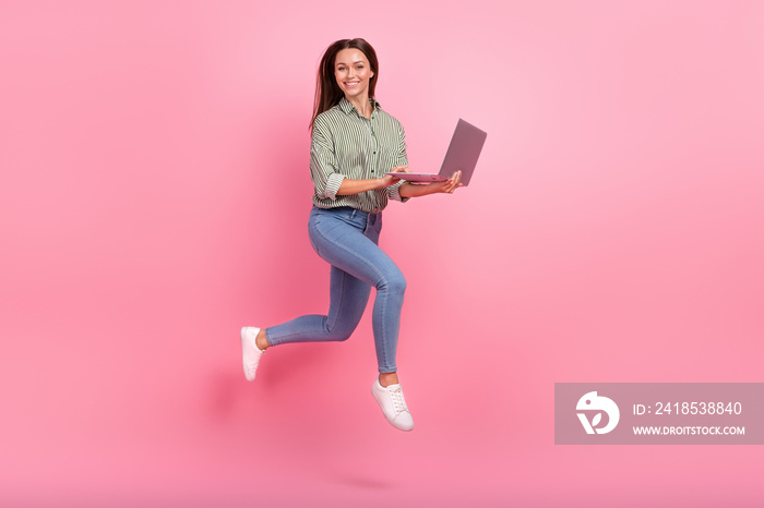 Full body photo of impressed millennial brunette lady run with laptop wear outfit jeans shoes isolat