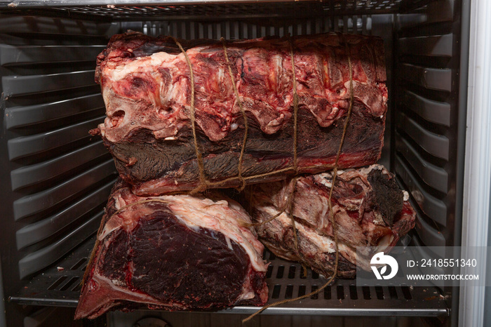 Meat in dry aging meat refrigerator