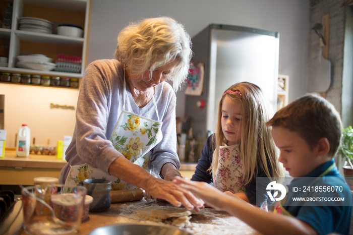 Grandma with her grandchildren in kitchen