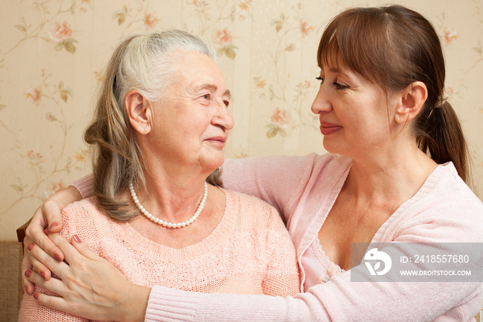 Senior woman with their caregiver at home.