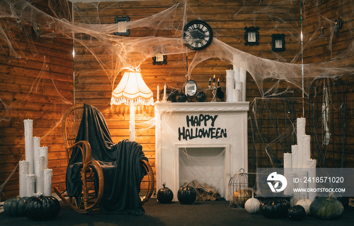 Cozy Halloween decorations with a fireplace and festive attributes. Photozone for Halloween. Backgro