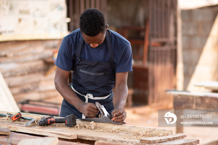 portrait of an african carpenter working