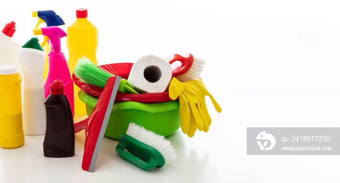 Cleaning supplies and bowls isolated against white background.