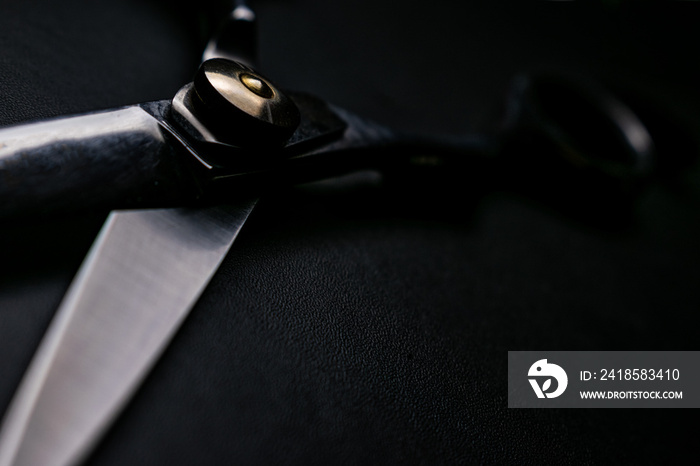 professional scissors on black background