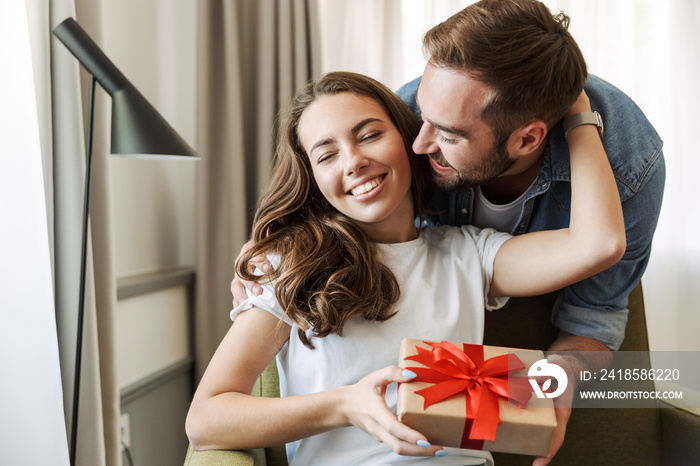 Beautiful young couple in love at home