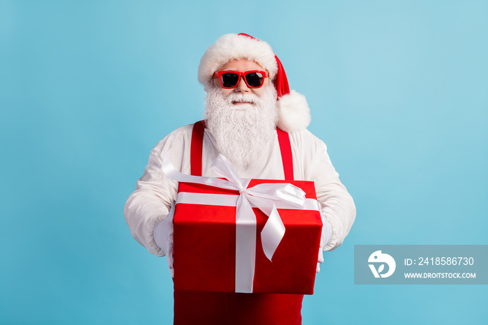 Portrait of his he nice attractive cheerful white-haired Santa father holding in hands big red bow r