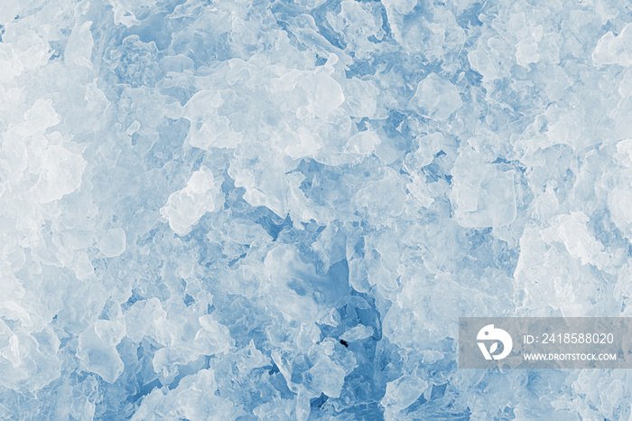 Ice texture background. The textured cold frosty surface of crushed ice.