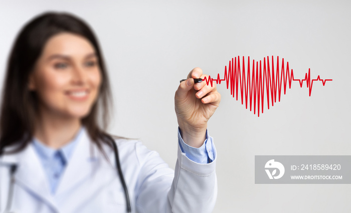 Female Doctor Using Stylus Drawing Heart Rate On Invisible Screen