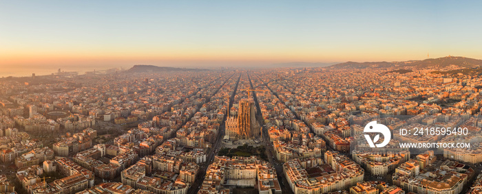 Aerial panorama drone shot of Barcelona city church in construction in sunrise hour in Spain winter