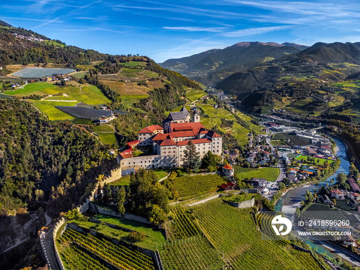 Klausen, Italy - Aerial view of the Säben Abbey (Monastero di Sabiona) with Chiusa (Klausen) comune 