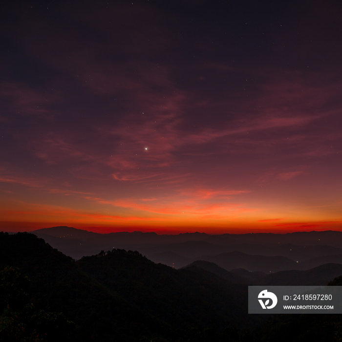 dramatic twilight winter sky with Venus star over mountains landscape