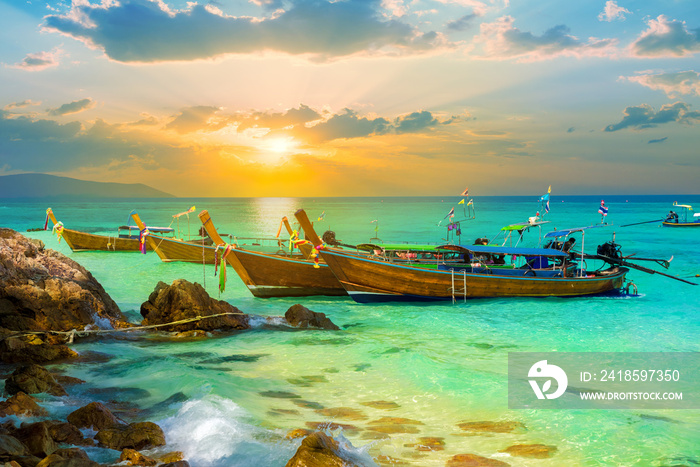 Vibrant sunset over Bamboo island of Thailand in summer holiday on tropical beach of Phi Phi region