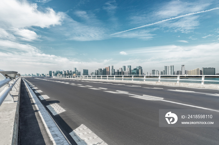 empty asphalt road with city skyline background in china..