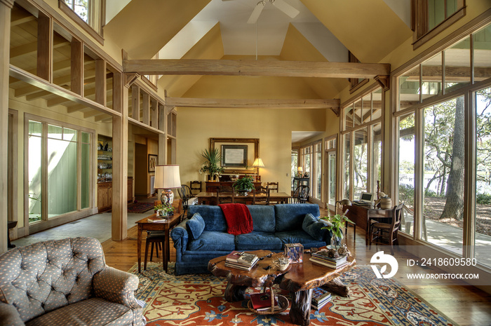 room with large windows and vaulted ceiling