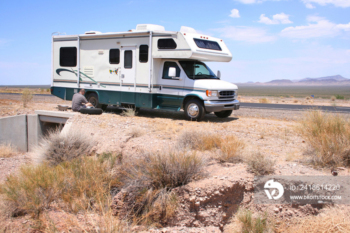 Motorhome RV with Flat in Desert