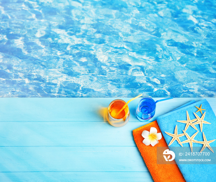 Summer beach set on swimming pool water background