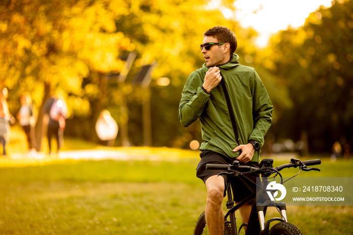 Young man riding ebike in the park