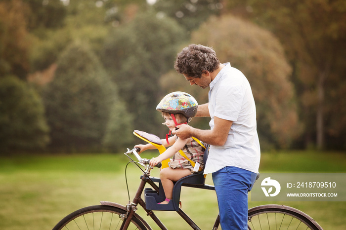 Father and daughter with bicycle in Prospect Park