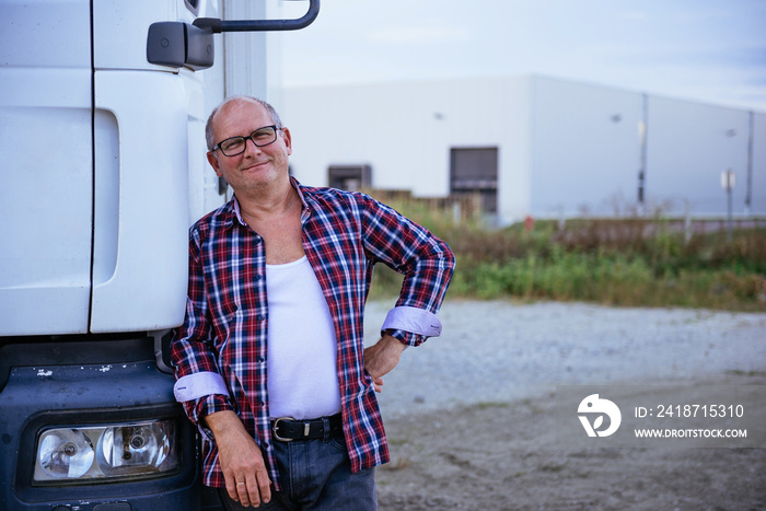 Posing next to his truck