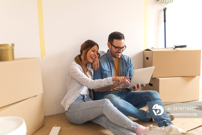 Happy couple in their new apartment.