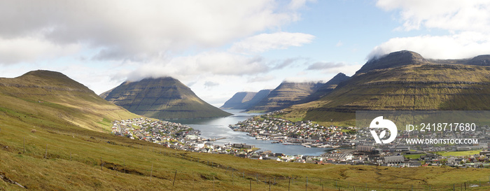 Klakkur and Suður á Nakki Mountain Peaks rising out of the Sea next to remote Klaksvík village in No