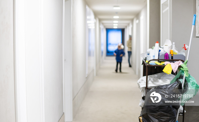 Cleaners trolley with cleaning equipments at hotel