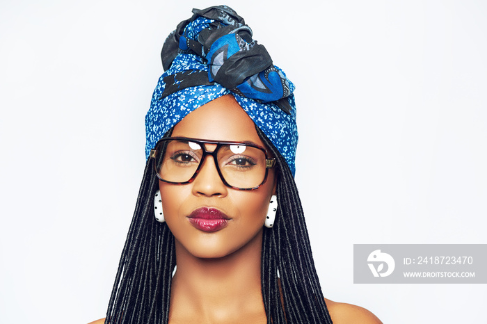 Black woman in headscarf and trendy glasses