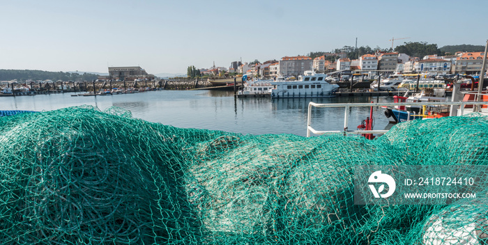 Fishing nets, panoramic view of the fishing port of o Grove, province of Pontevedra, Spain