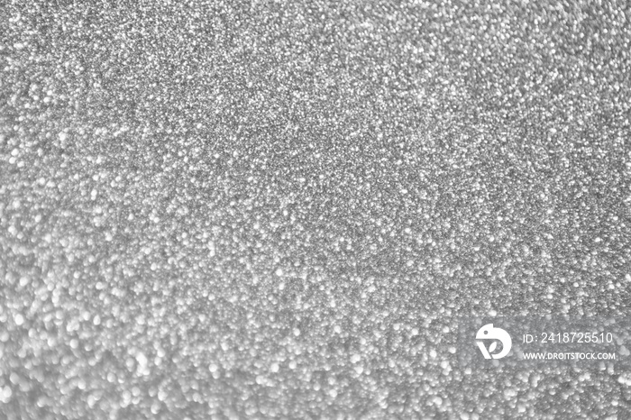 Abstract blur silver glitter sparkle defocused bokeh light background