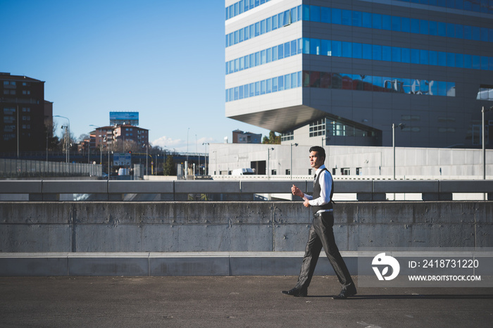 Young businessman in the street, Milan, Italy