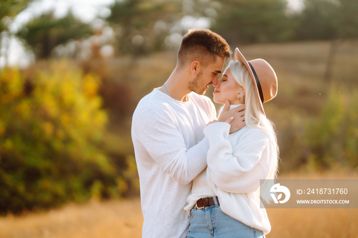 Romantic young couple in stylish clothes walking together. Autumn weather.  Travel, weekend, relax .