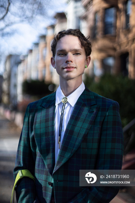 non-binary caucasian person with short brown hair at home