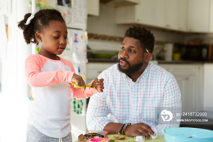 Father and daughter enjoying handicraft activity