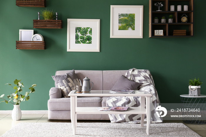 Interior of beautiful modern room with green wall